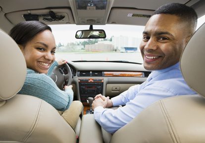 Auto Plus Insurance Group LLC | A father teaching his daughter how to drive a car